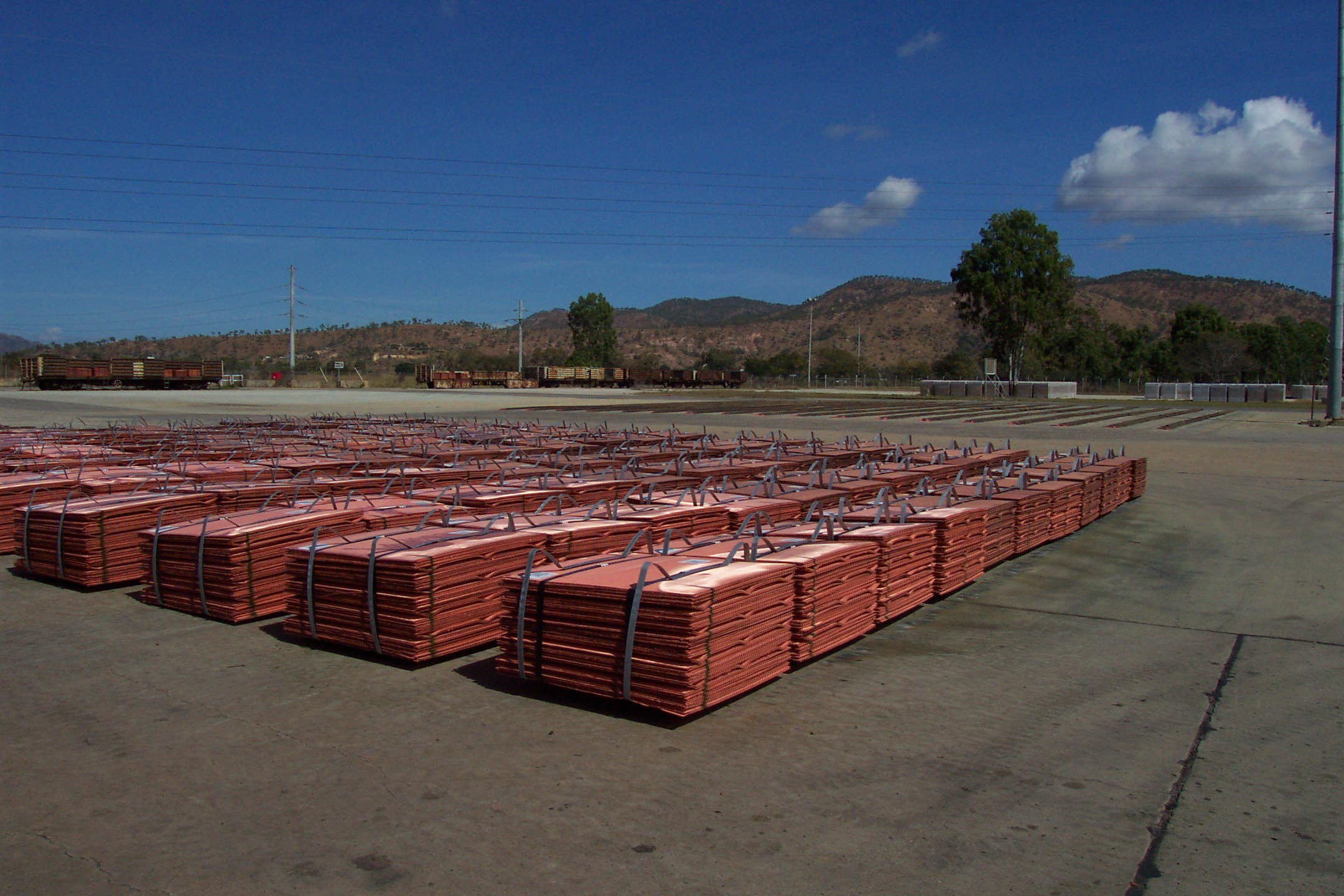 Bundles of refined copper cathodes prepared for transport outside a refinery
