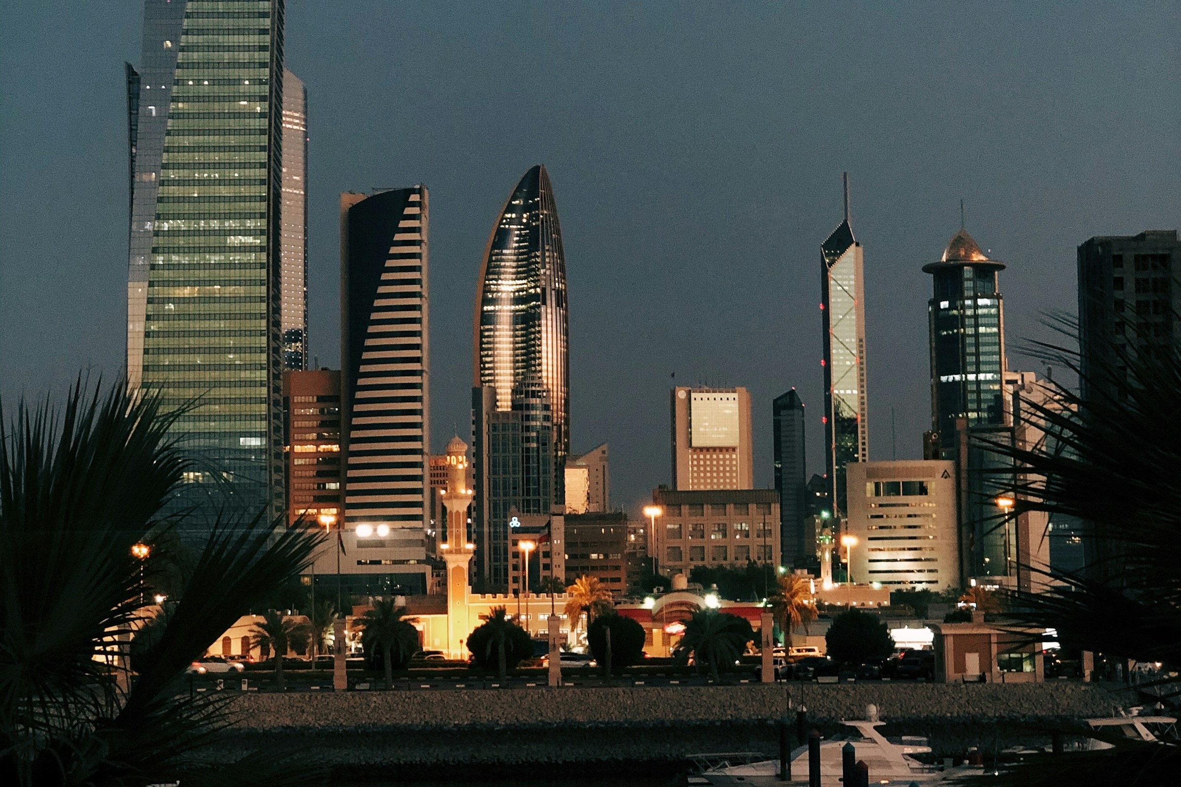 Kuwait City’s illuminated commercial skyline after sunset