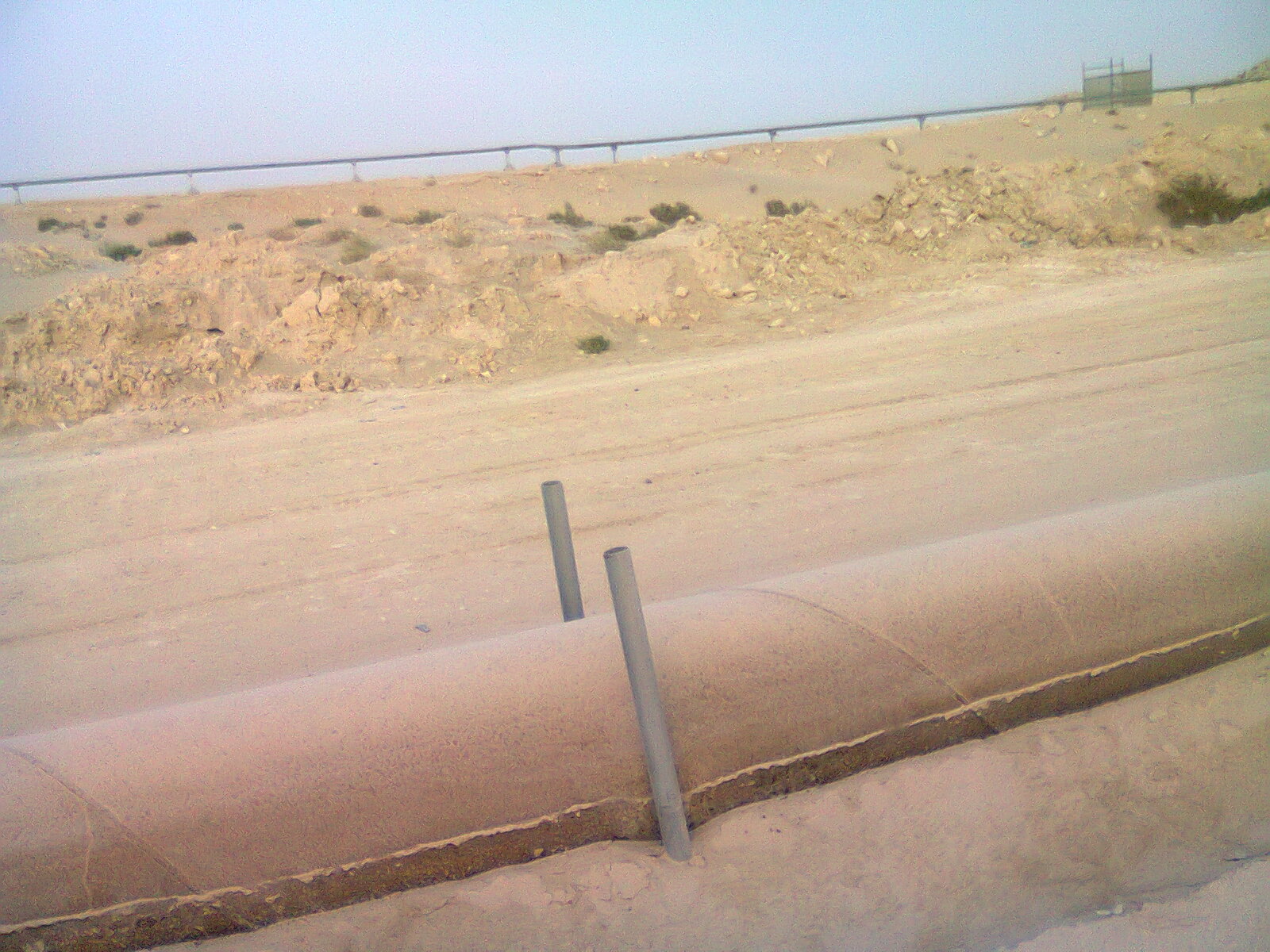 Oil pipelines crossing the desert near Al Jubail, Saudi Arabia